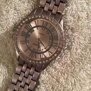 NWOT Rose tone bracelet watch diamonds around face